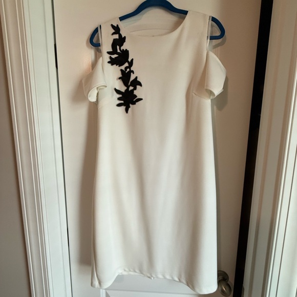 Sharagano Dresses & Skirts - Sharagano White Cold Shoulder Sheath Dress with Black Appliqué